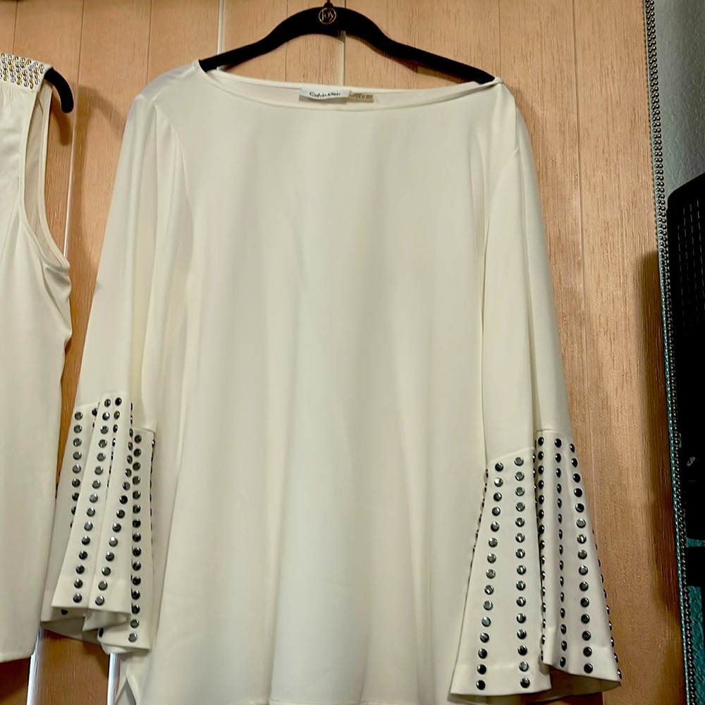 Cream long sleeve blouse.